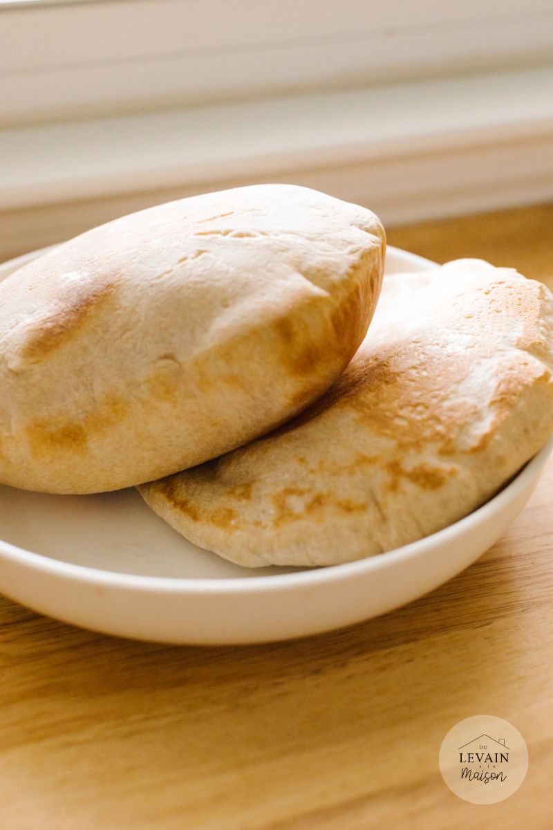 two pita breads in a white plate